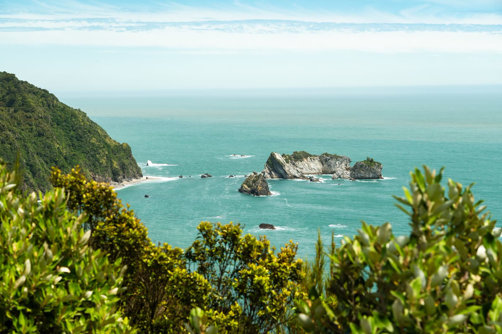 Turquoise bay with small forested islets — the waters charter crews and water tours work